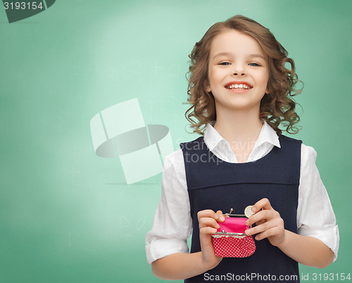 Image of happy girl with purse and euro coin money