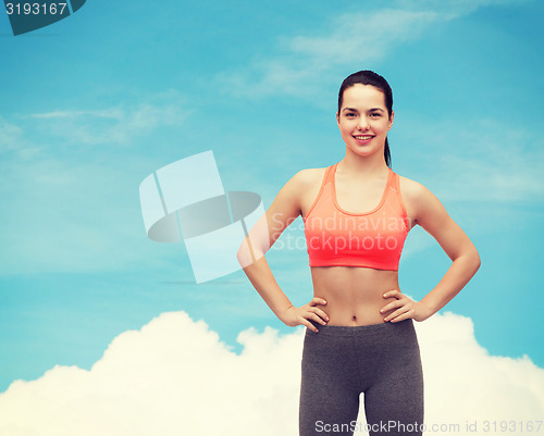 Image of smiling teenage girl in sportswear