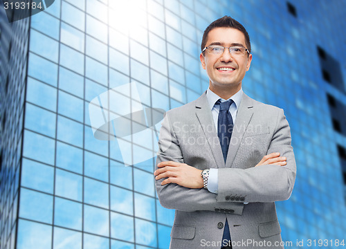 Image of happy smiling businessman in eyeglasses and suit