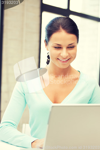 Image of happy woman with laptop computer