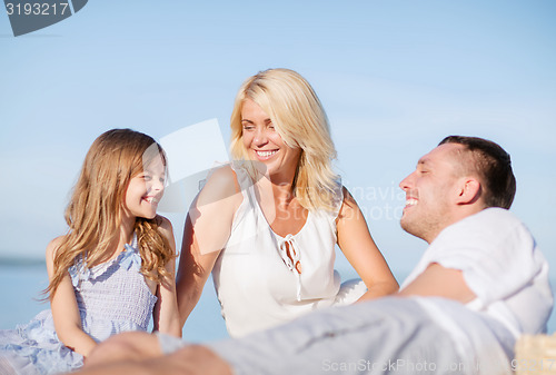 Image of happy family having a picnic
