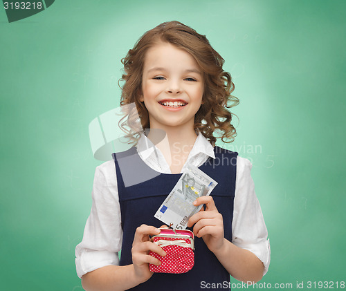 Image of happy girl with purse and paper money