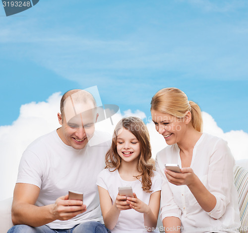 Image of happy family with smartphones