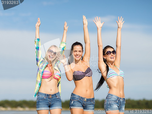 Image of beautiful teenage girls or young women on beach