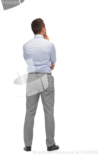 Image of businessman thinking from back