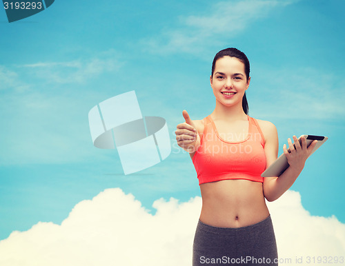 Image of sporty woman with tablet pc computer