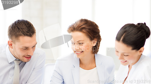 Image of business team discussing something in office