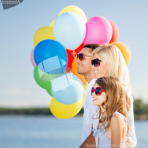 Image of family with colorful balloons