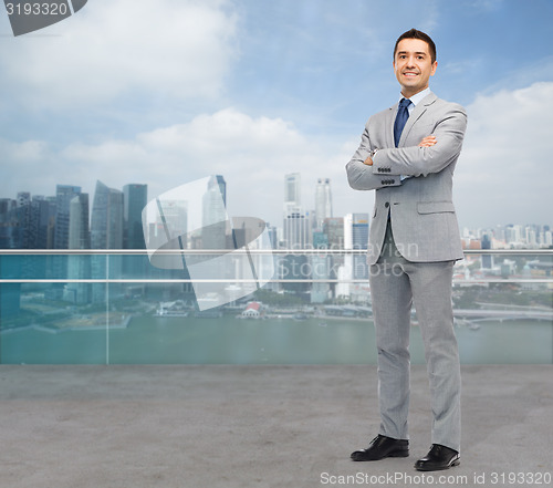 Image of happy smiling businessman in suit