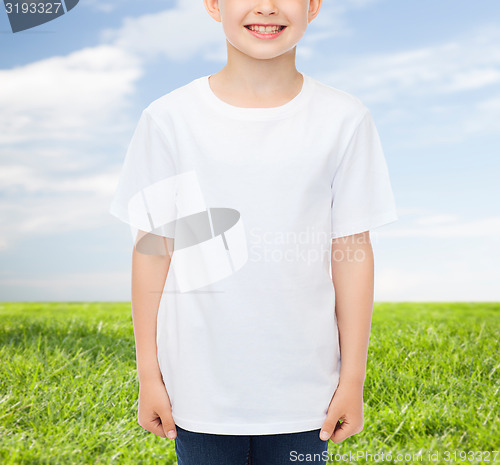 Image of smiling little boy in white blank t-shirt