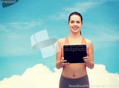 Image of sporty woman with tablet pc blank screen