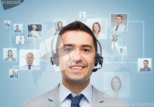 Image of smiling businessman in headset