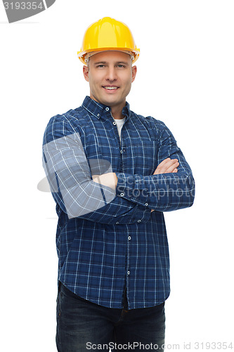 Image of smiling male builder or manual worker in helmet