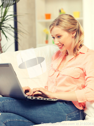 Image of happy woman with laptop computer