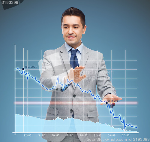 Image of businessman touching virtual screen with chart