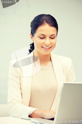 Image of happy woman with laptop computer