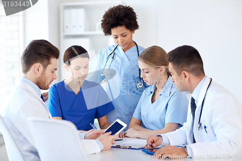 Image of group of doctors with tablet pc at hospital