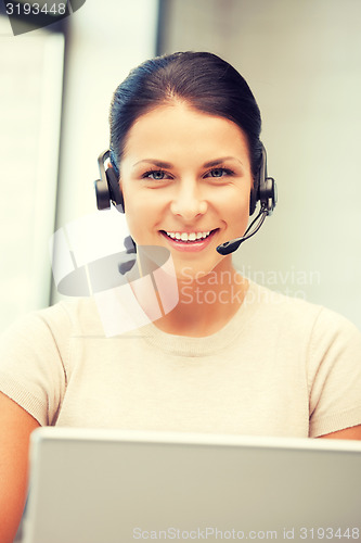 Image of helpline operator with laptop computer