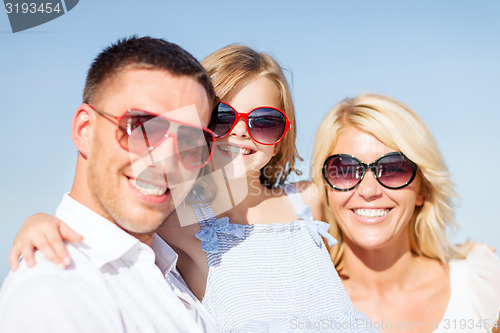Image of happy family with blue sky