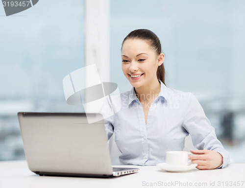 Image of smiling businesswoman or student with laptop