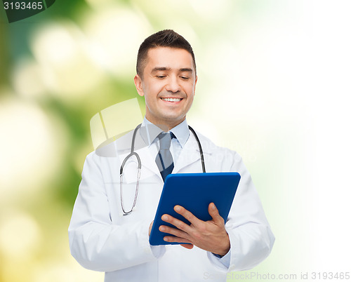 Image of smiling male doctor in white coat with tablet pc