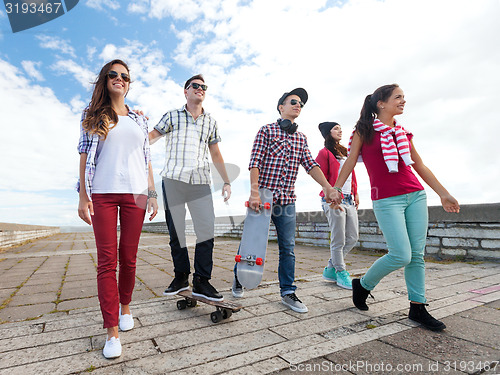 Image of teenagers with skates outside