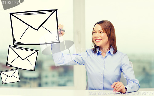 Image of businesswoman drawing envelope