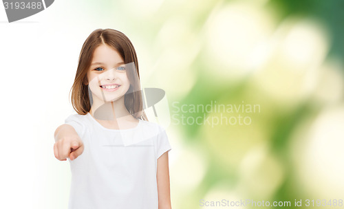 Image of smiling little girl in white blank t-shirt