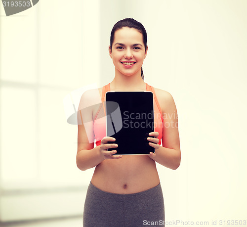 Image of sporty woman with tablet pc blank screen