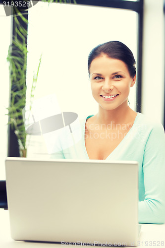 Image of happy woman with laptop computer