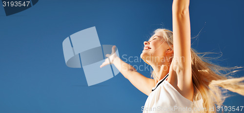 Image of beautiful woman enjoying summer outdoors