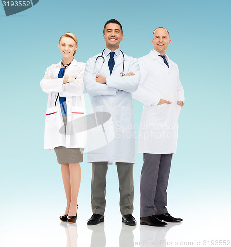 Image of group of smiling doctors in white coats