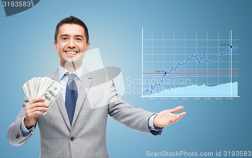 Image of smiling businessman with dollar money