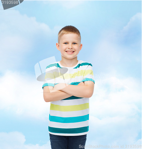 Image of little boy in casual clothes with arms crossed