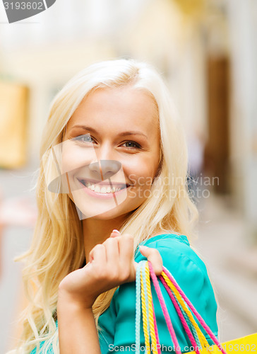 Image of woman with shopping bags in ctiy