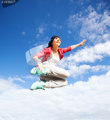 Image of beautiful dancing girl jumping