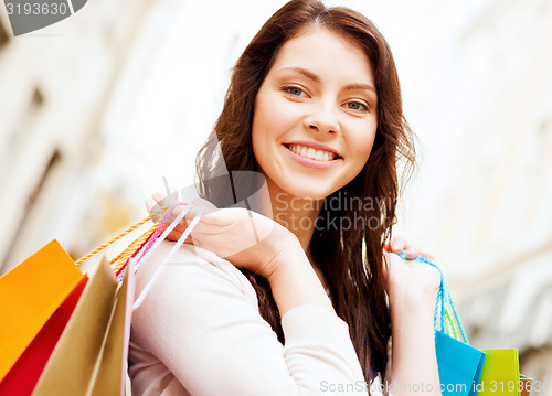 Image of woman with shopping bags in ctiy