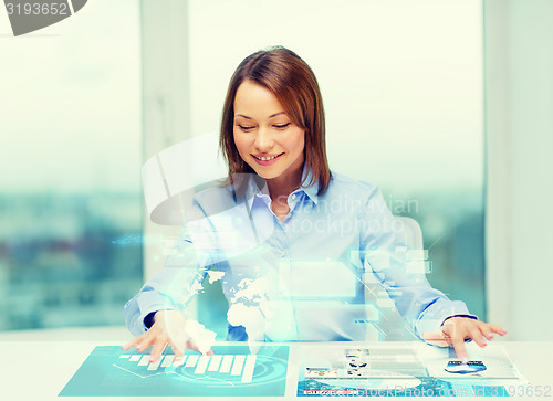 Image of woman pointing to buttons on virtual screen