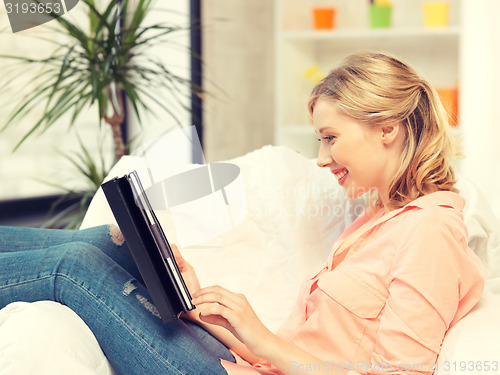 Image of happy woman with tablet pc computer