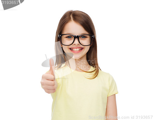 Image of smiling cute little girl in black eyeglasses