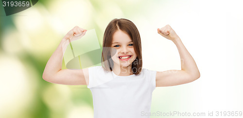 Image of smiling little girl in white blank t-shirt