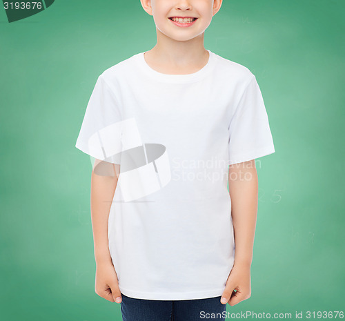 Image of smiling little boy in white blank t-shirt