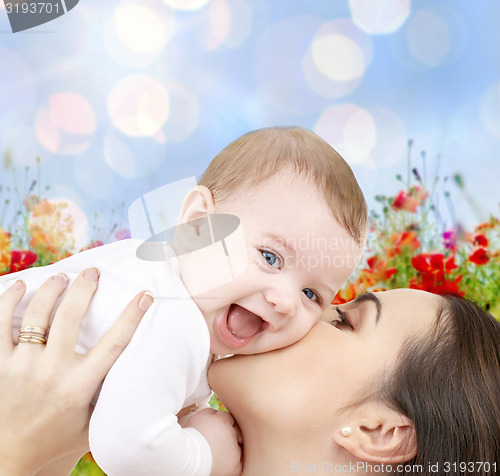 Image of happy mother with baby over natural background