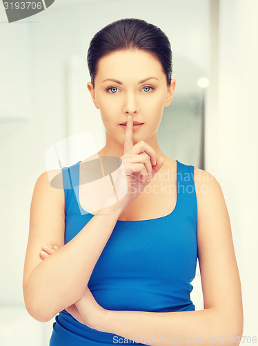 Image of woman making a hush gesture