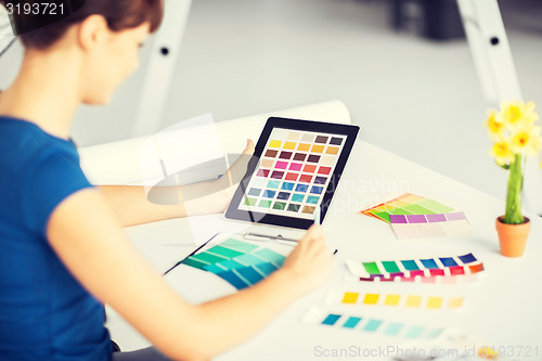 Image of woman working with color samples for selection