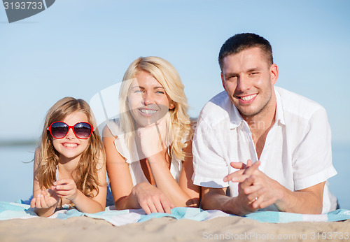 Image of happy family on the beach