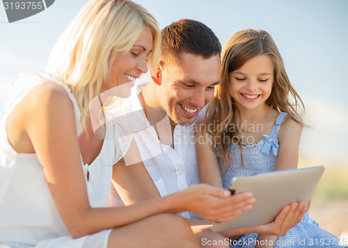 Image of happy family with tablet pc taking picture