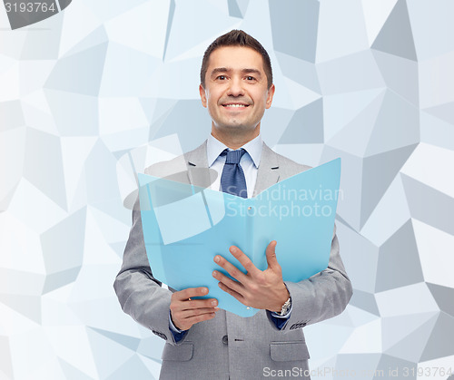Image of happy businessman with open folder