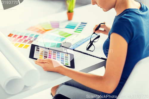 Image of woman working with color samples for selection