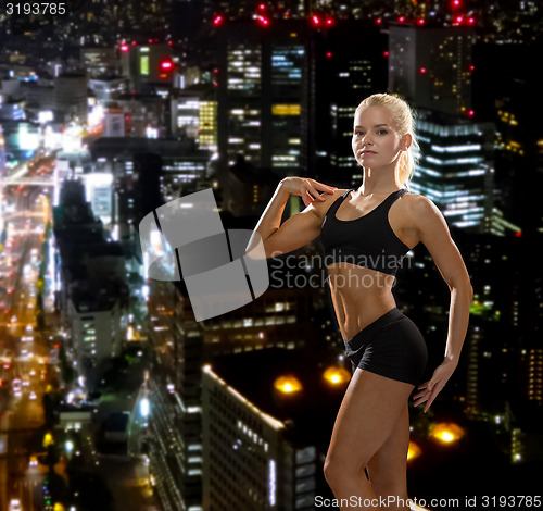 Image of beautiful athletic woman in sportswear